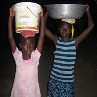 Picture of children carrying water.